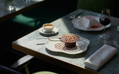 Elegant table setting at Le Jardinier, showcasing fine dining with modern plating and soft natural light.